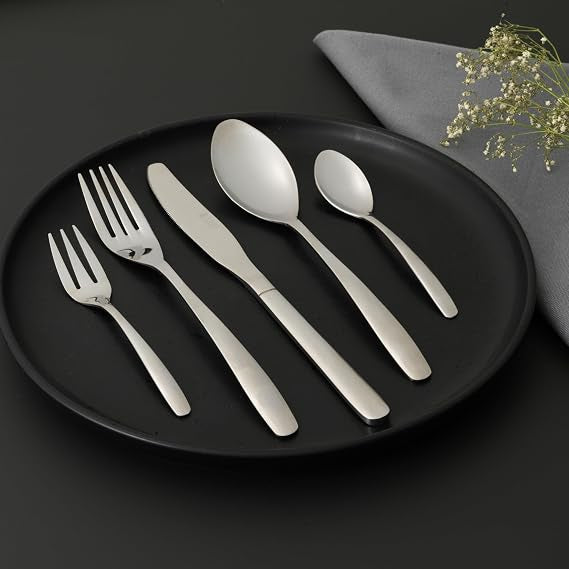 Front view of the 20-piece Russell Hobbs Florence silver stainless steel cutlery set neatly arranged on a white table setting.
