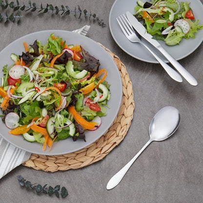 Top-down view of the 44-piece silver polished Russell Hobbs Lisbon stainless steel cutlery set arranged neatly on a dark wooden dining table setting.