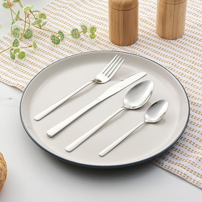 Top-down view of the 48-piece Russell Hobbs Vienna stainless steel cutlery set with a mirror polish finish arranged neatly on a wooden dining table.