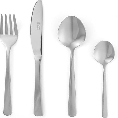 Silver Russell Hobbs Vienna 24-piece stainless steel cutlery set with mirror finish arranged neatly on a dining table.