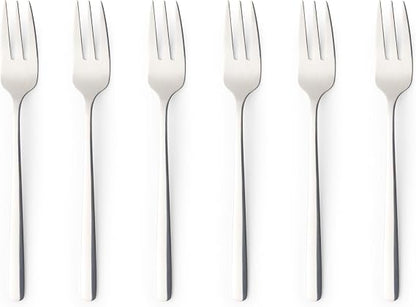 Six pack of silver polished 18/0 stainless steel Russell Hobbs Vienna dessert forks arranged neatly on a dark wooden dining table.