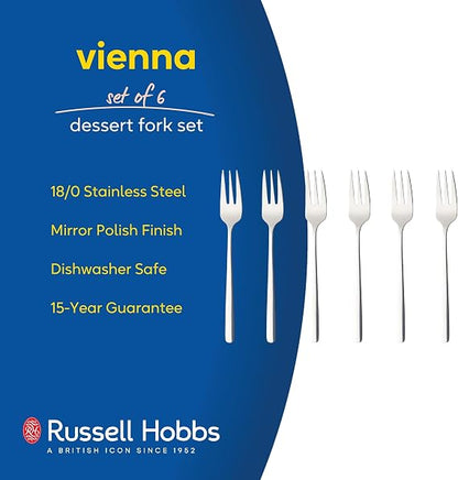 Six pack of silver polished 18/0 stainless steel Russell Hobbs Vienna dessert forks arranged neatly on a dark wooden dining table.