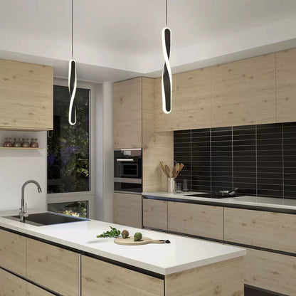 Black Artika Finley LED pendant light with modern minimalist design, suspended over kitchen island for ambient lighting