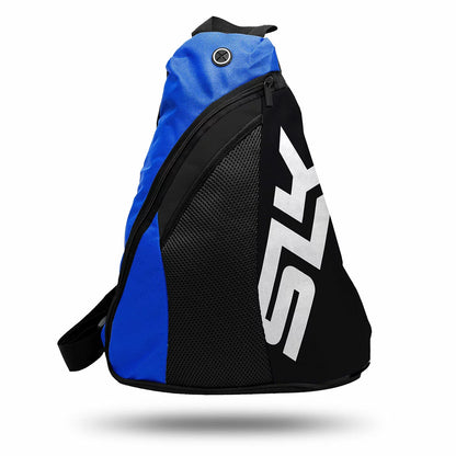 A close-up studio shot of two SLK Prime Max pickleball paddles in red and blue finishes, resting alongside three high-durability yellow pickleball balls and a black protective sling bag.