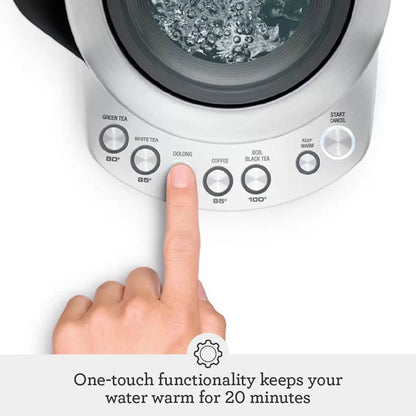 The stainless-steel Sage Smart Kettle Luxe with its backlit LCD display and ergonomic handle, shown on a clean kitchen countertop.