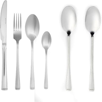 Overhead view of the silver Salter Buxton 20-piece stainless steel cutlery set arranged on a modern dark wood dining table setup.