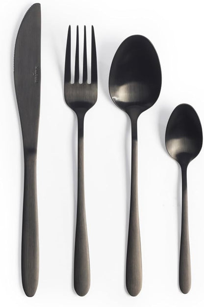 Overhead view of the 16-piece Salter Chiltern cutlery set in brushed matte black stainless steel arranged neatly on a dark slate dining table.