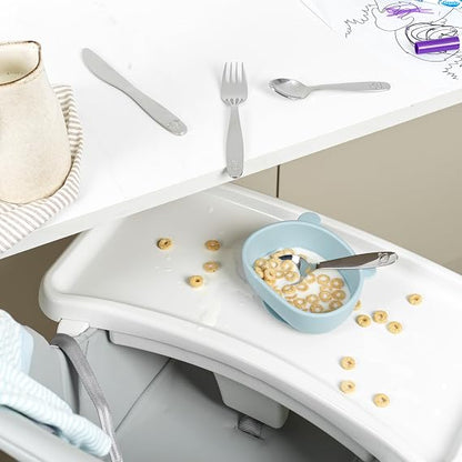 Salter 12-piece stainless steel kids cutlery set with farmyard animal engravings laid out on a clean light table setting.