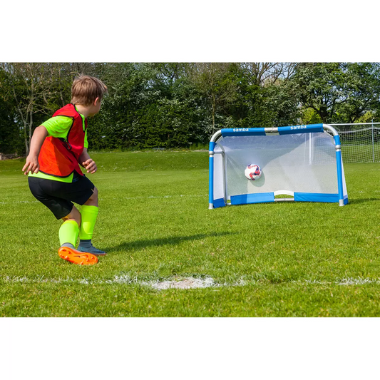 Pair of silver Samba 5ft x 3ft folding aluminium goals with black nets set up opposite each other on a green grass football pitch.