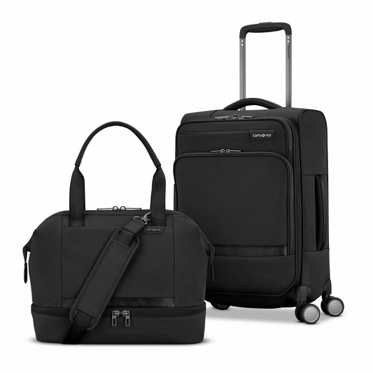 Side view of the midnight blue Samsonite Apex XLT 2 piece set with the weekender duffel stacked securely on top of the carry-on spinner against a clean stone backdrop.