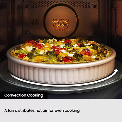 Black Samsung 32L smart microwave oven with glass door and digital control panel sitting on a contemporary kitchen countertop beside cooked food.