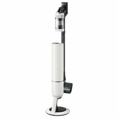 Sleek Samsung Bespoke Jet AI Lite Pro vacuum securely docked in its tall, black auto-emptying Clean Station on a modern hardwood floor.