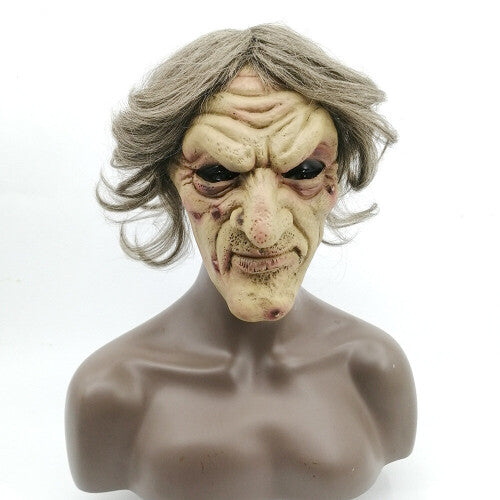 Front view of an overhead green latex evil witch mask featuring deep face wrinkles, synthetic hair strands, and large eye cutouts for Halloween cosplay.
