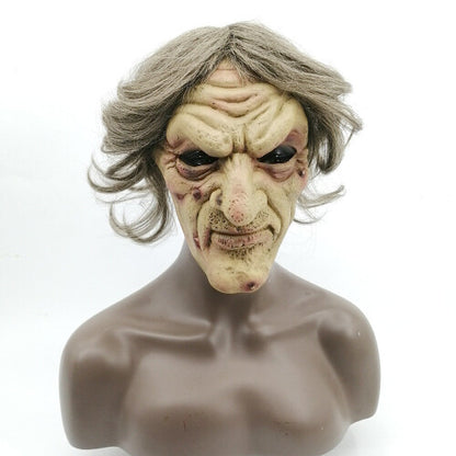 Front view of an overhead green latex evil witch mask featuring deep face wrinkles, synthetic hair strands, and large eye cutouts for Halloween cosplay.