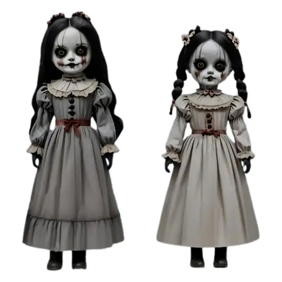 Front view of two scary voice-controlled Halloween ghost doll ground decorations made of pale white PVC plastic positioned on a green lawn.
