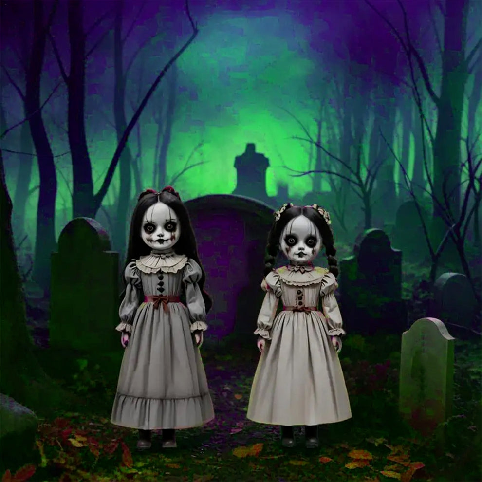Front view of two scary voice-controlled Halloween ghost doll ground decorations made of pale white PVC plastic positioned on a green lawn.