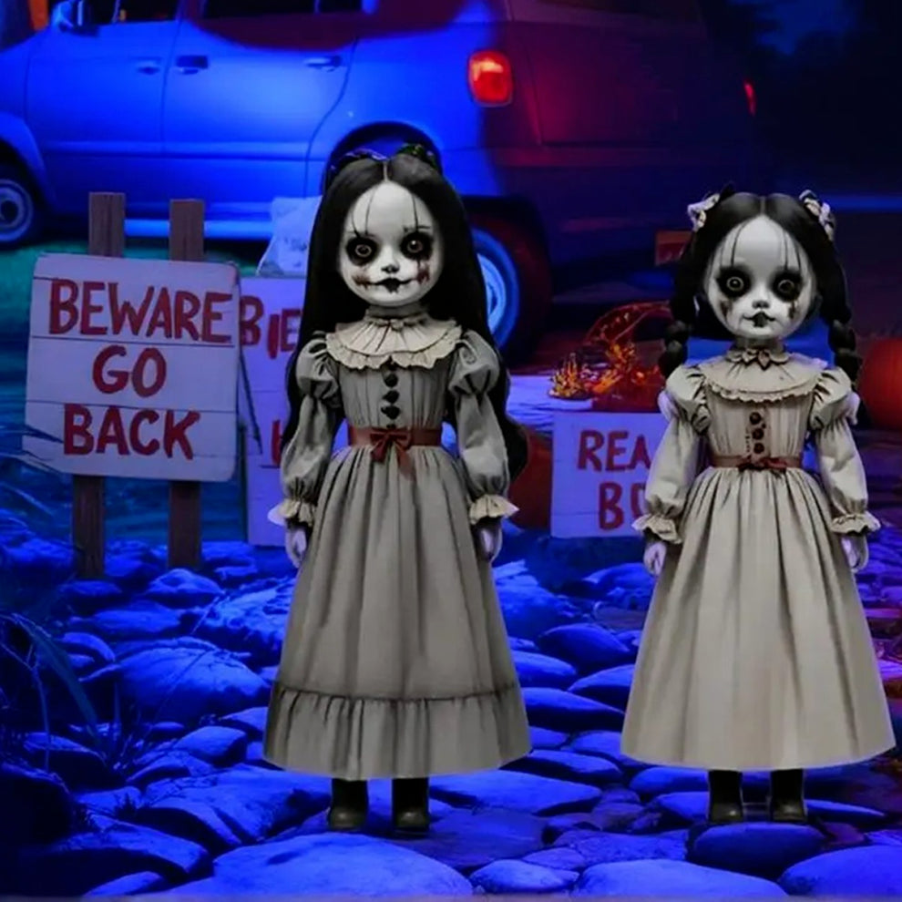 Front view of two scary voice-controlled Halloween ghost doll ground decorations made of pale white PVC plastic positioned on a green lawn.