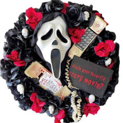 Front view of a 43cm round Halloween ghost door wreath with black and white draped polyester fabric hanging on a front entry door.