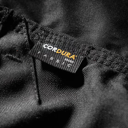 Front view of Scruffs men's black Trade Flex work trousers featuring holster pockets, top-loading CORDURA knee pad slots, and durable stretch fabric for trade professionals.
