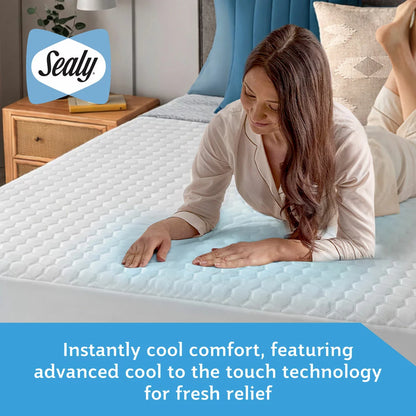 Top-down view of the white textured Sealy Advance Cool Mattress Protector on a bed showing its patterned quilted finish and 30 cm elasticated skirt.