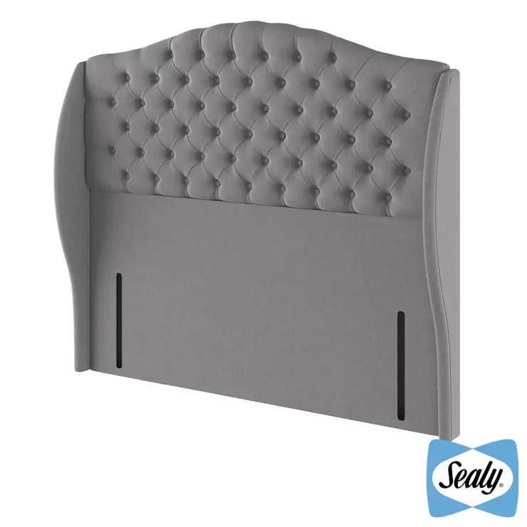 Front view of the Sealy Richmond full height king headboard in Silver Fox grey fabric featuring deep button-tufting against a modern bedroom backdrop.