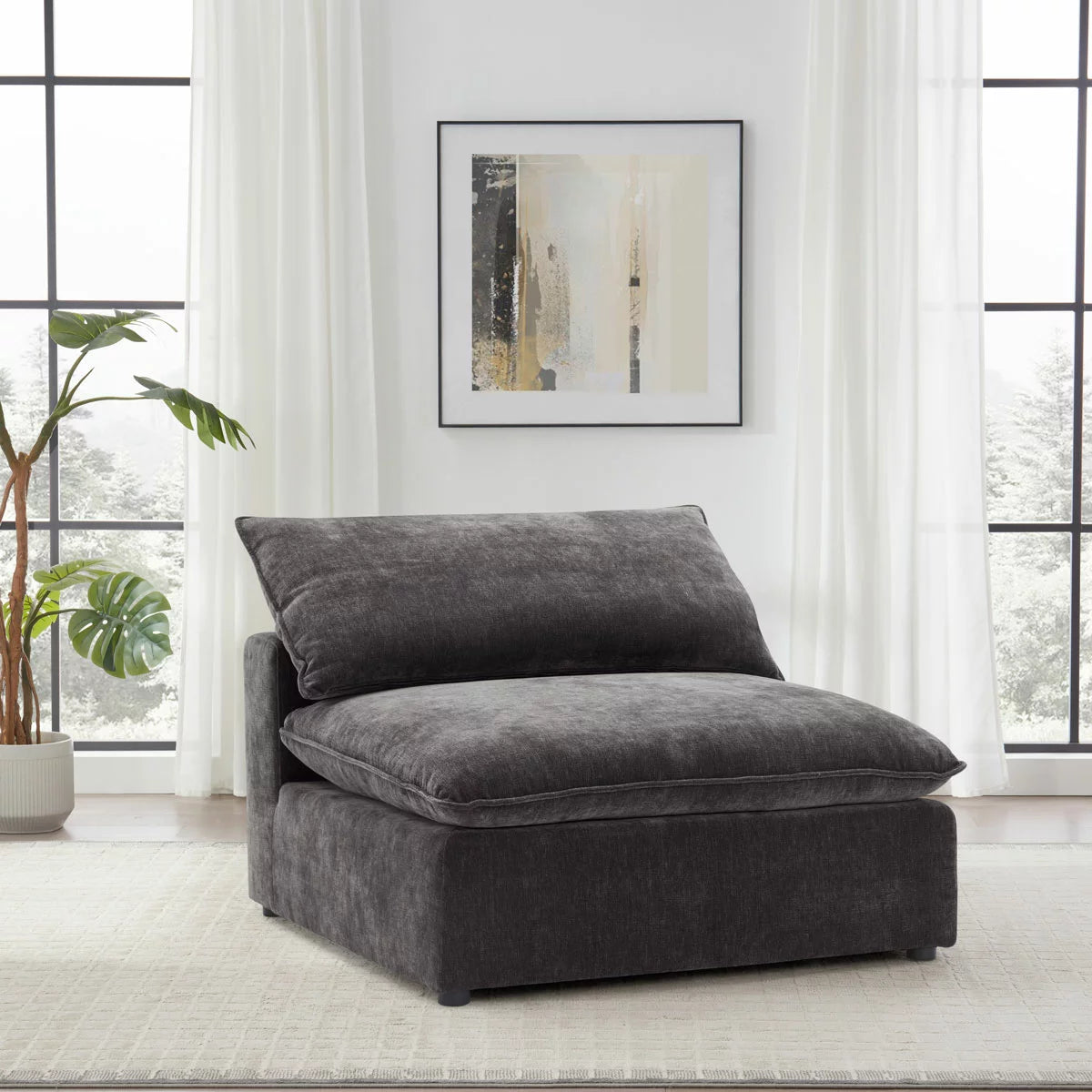 Front angle view of the Aiden & Ivy Sereen dark grey fabric armless chair, showcasing its textured upholstery, deep feather-blend seat, and clean minimalist profile in a contemporary apartment setting.