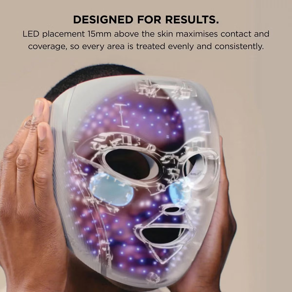 Shark CryoGlow LED therapy mask in Lilac Chill with silicone eye guards, attached handheld controller, and USB-C cable displayed on a white marble vanity.
