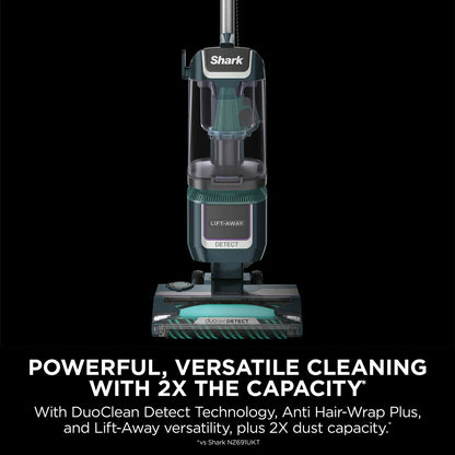 Front view of the navy and silver Shark Detect XL Pet Pro upright vacuum cleaner standing on a clean hardwood floor in a modern living room setting.