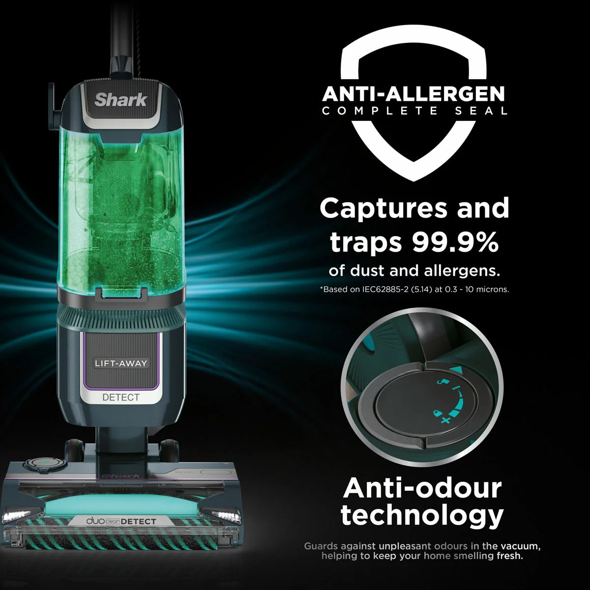 Front view of the navy and silver Shark Detect XL Pet Pro upright vacuum cleaner standing on a clean hardwood floor in a modern living room setting.