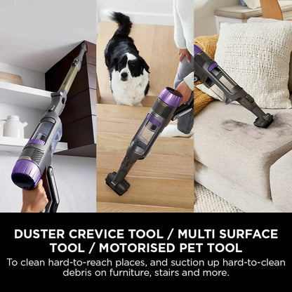 Front view of the dark teal Shark PowerDetect IP3251UKT cordless vacuum cleaner docked on its upright auto-empty charging base in a modern living room setting.