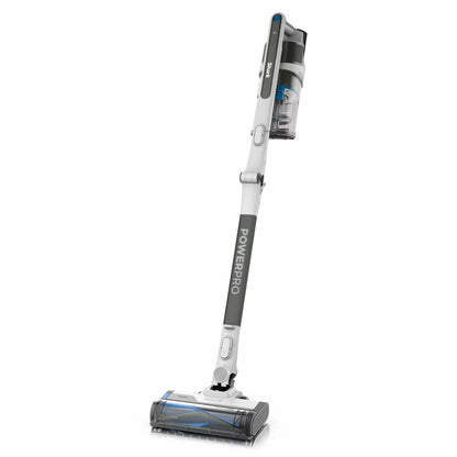 Shark PowerPro Pet Cordless Stick Vacuum IZ380UKT in use on carpet, removing pet hair with Anti Hair Wrap technology and cordless convenience.