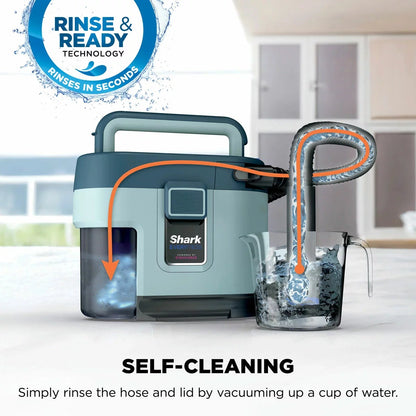 Front angle view of the charcoal grey Shark VX110UK EveryMess 3-in-1 vacuum with attached hose and crevice tool resting on a clean living room rug.