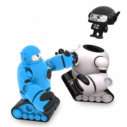 Front angle shot of two Sharper Image Mecha Rivals RC robots in red and blue armor facing off with lit-up LED chests on a wooden table.