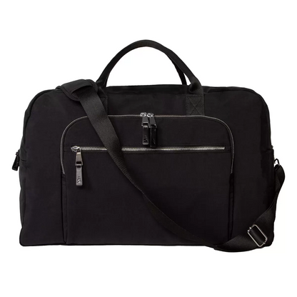 Side view of the water-repellent Shed Rain Weekender Bag showing its textured recycled nylon, exterior zip pockets, and attached trolley sleeve.