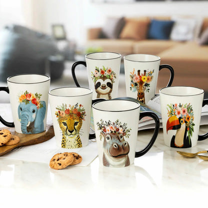 A set of six Signature Housewares 483ml stoneware mugs featuring colourful illustrations of a toucan, giraffe, hippo, elephant, cheetah, and sloth wearing hipster accessories, displayed on a clean kitchen counte