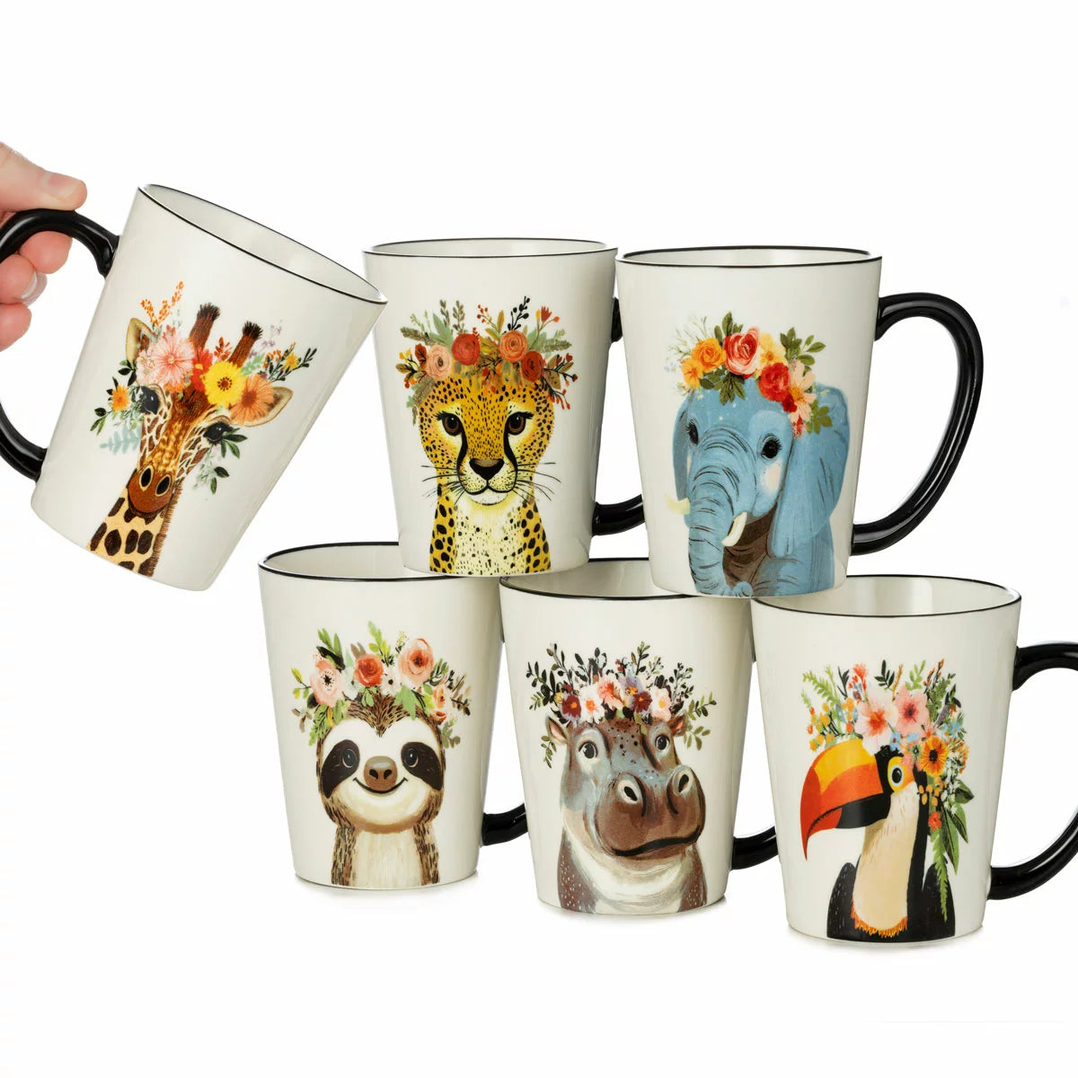 A set of six Signature Housewares 483ml stoneware mugs featuring colourful illustrations of a toucan, giraffe, hippo, elephant, cheetah, and sloth wearing hipster accessories, displayed on a clean kitchen counte 
