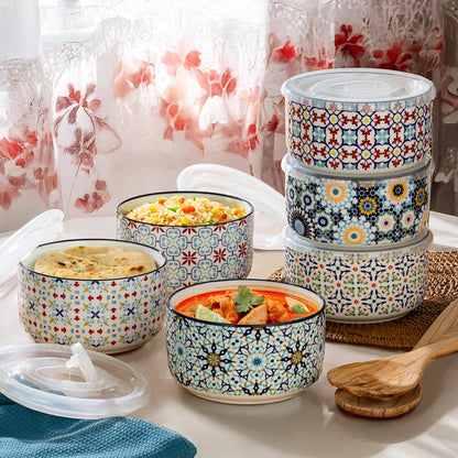 The Signature Stoneware Bowls with Lids 6-Pack displayed on a table, showcasing their colorful patterned exteriors and matching storage lids.