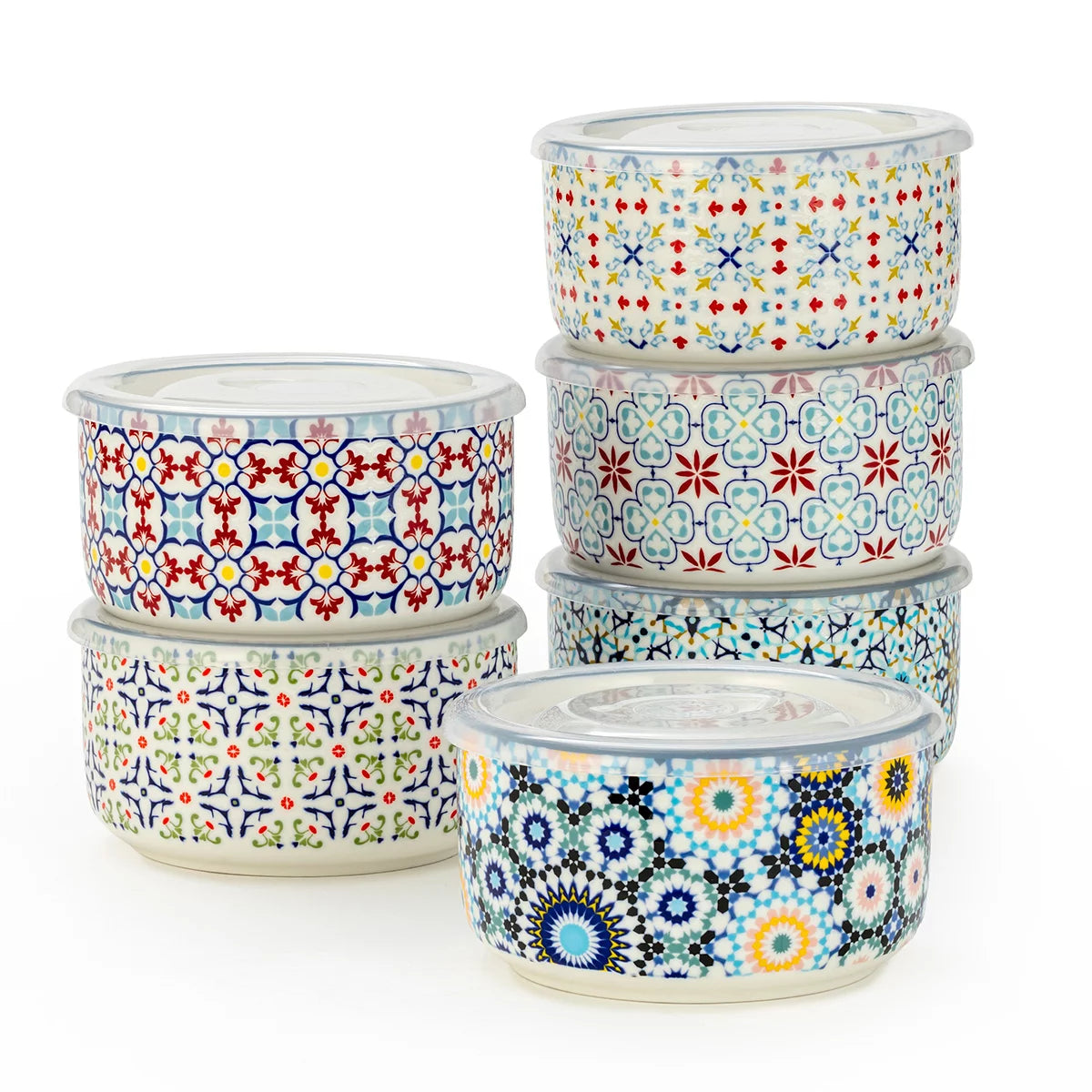 The Signature Stoneware Bowls with Lids 6-Pack displayed on a table, showcasing their colorful patterned exteriors and matching storage lids.