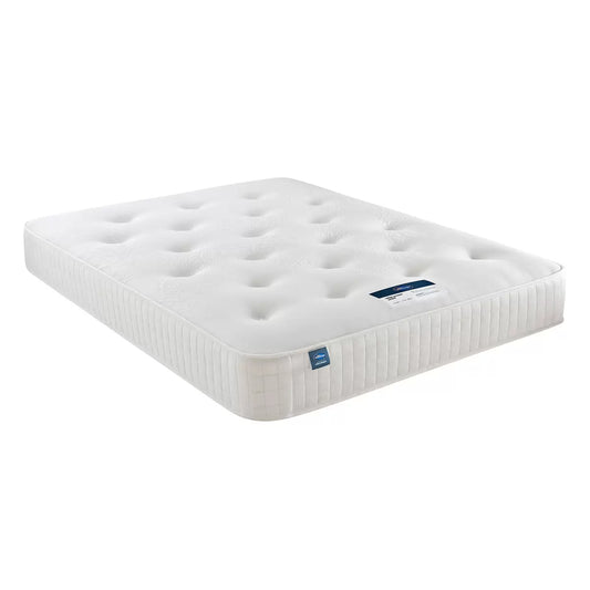 A high-angle close-up of the Silentnight 1400 Pocket Ortho Single Mattress, showcasing its clean white hand-tufted soft-knit surface and 25.5 cm deep profile on a modern wooden bed frame.