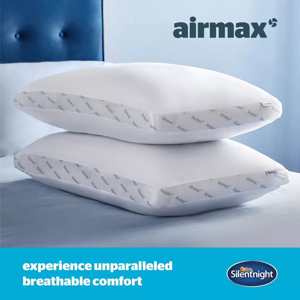 Crisp white Silentnight Airmax 10.5 Tog duvet and two matching pillows with blue mesh side borders arranged neatly on a freshly dressed bed.