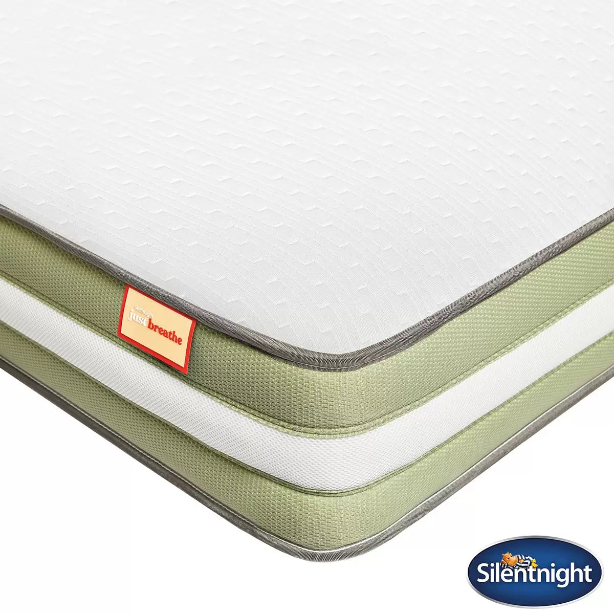 Side view of the rolled Silentnight Just Breathe single mattress showing the white soft-knit hypoallergenic cover and breathable 3D fabric border.