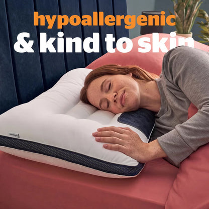 White contoured Silentnight Smart Sleep Magnetic Neck Therapy Pillow with microfibre cover resting on a contemporary bed.