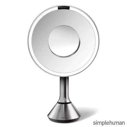 Simplehuman 8-inch Round Sensor Mirror with the 10x detail attachment in place, showcasing its sleek, cordless design.