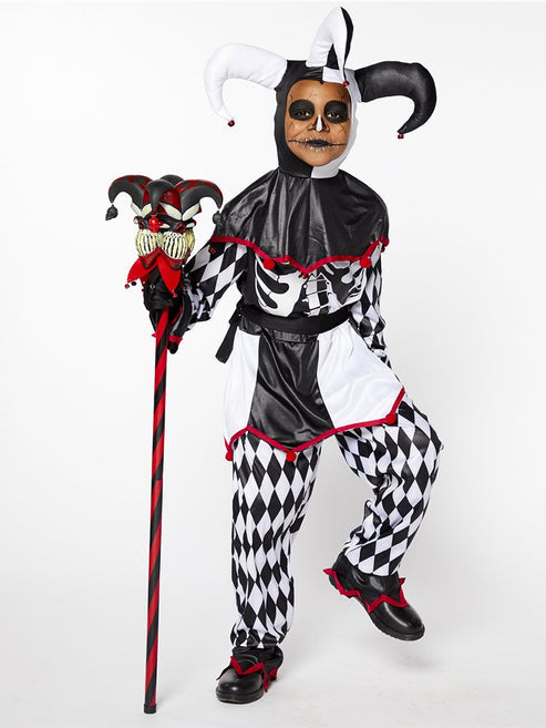 Full-length photo of the Sinister Jester Clown costume showing monochrome diamond trousers, skeleton tunic, waist sash, eerie red-eyed mask, and bell-topped hat.