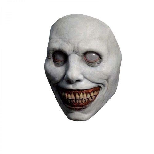 White smiling demon Halloween mask made of flexible latex featuring stark black eye sockets, a wide eerie grin, and red teeth displayed against a neutral background.