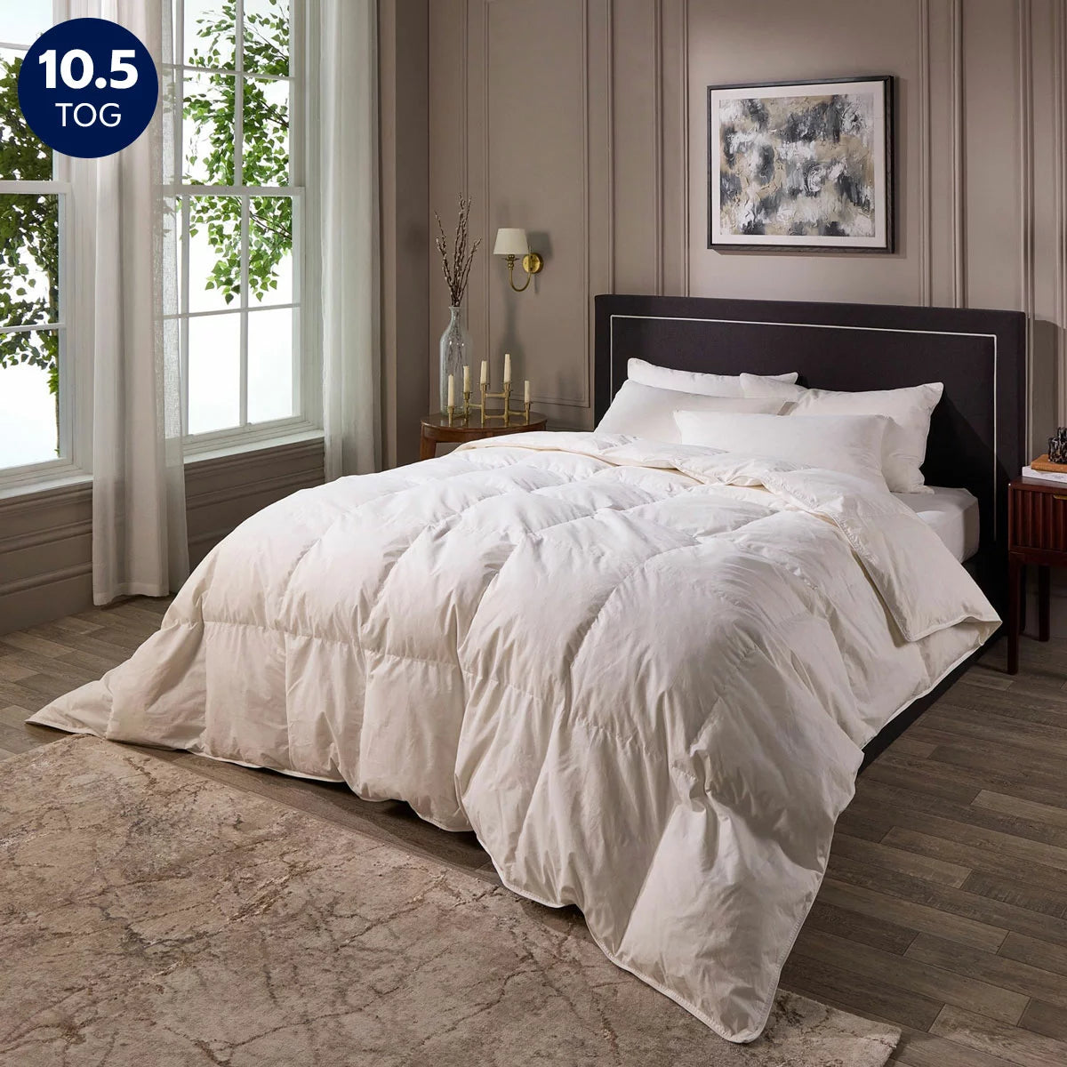 Close-up shot of the white Snuggledown Hotel Signature Goose Feather double duvet featuring double-stitched piping on a styled bed.