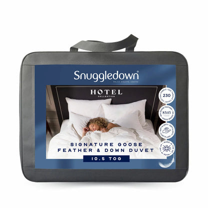 Close-up shot of the white Snuggledown Hotel Signature Goose Feather double duvet featuring double-stitched piping on a styled bed.
