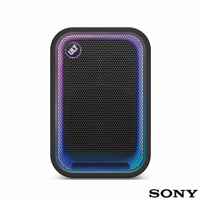 Black Sony ULT500 portable Bluetooth tower speaker with active LED rim lighting shown standing outdoors on a wooden patio deck.