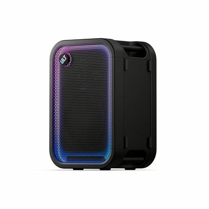 Black Sony ULT500 portable Bluetooth tower speaker with active LED rim lighting shown standing outdoors on a wooden patio deck.
