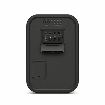 Black Sony ULT500 portable Bluetooth tower speaker with active LED rim lighting shown standing outdoors on a wooden patio deck.